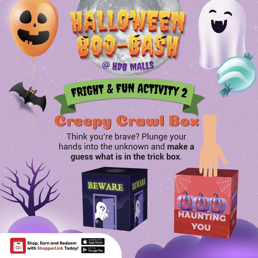 A hand cautiously exploring the contents of the Creepy Crawl Box, filled with Halloween surprises.