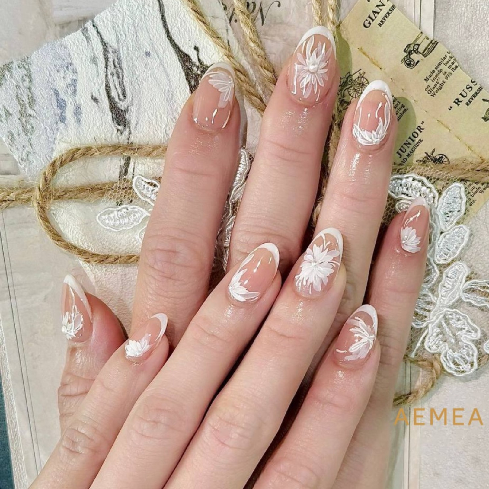 A close-up of beautifully manicured nails with intricate designs