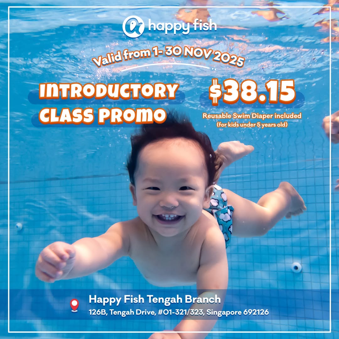 Children happily learning to swim in a heated indoor pool at Happy Fish Swim School