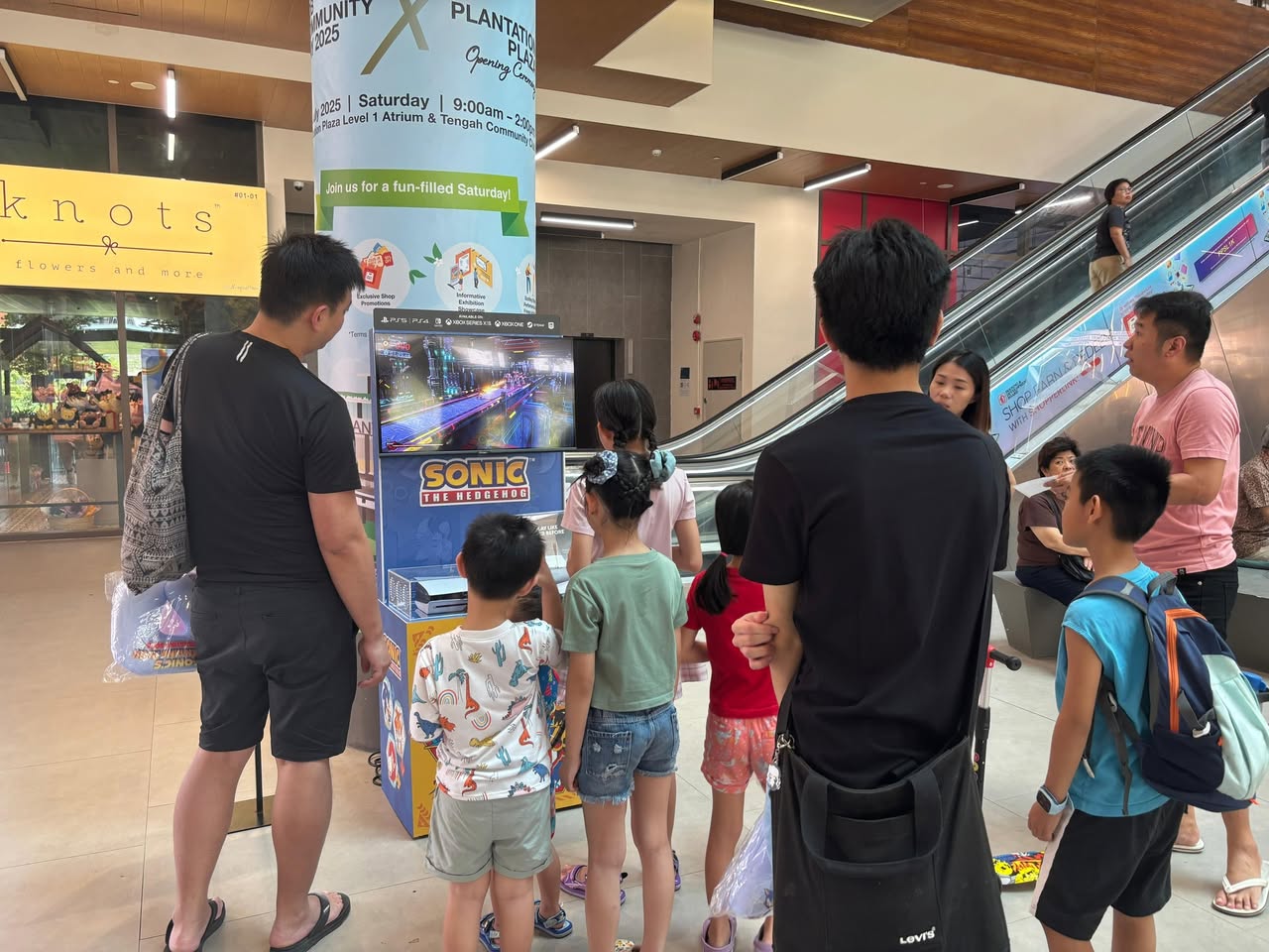 Attendees enjoying the Sonic's Golden Ring Rush event with activities and decorations.