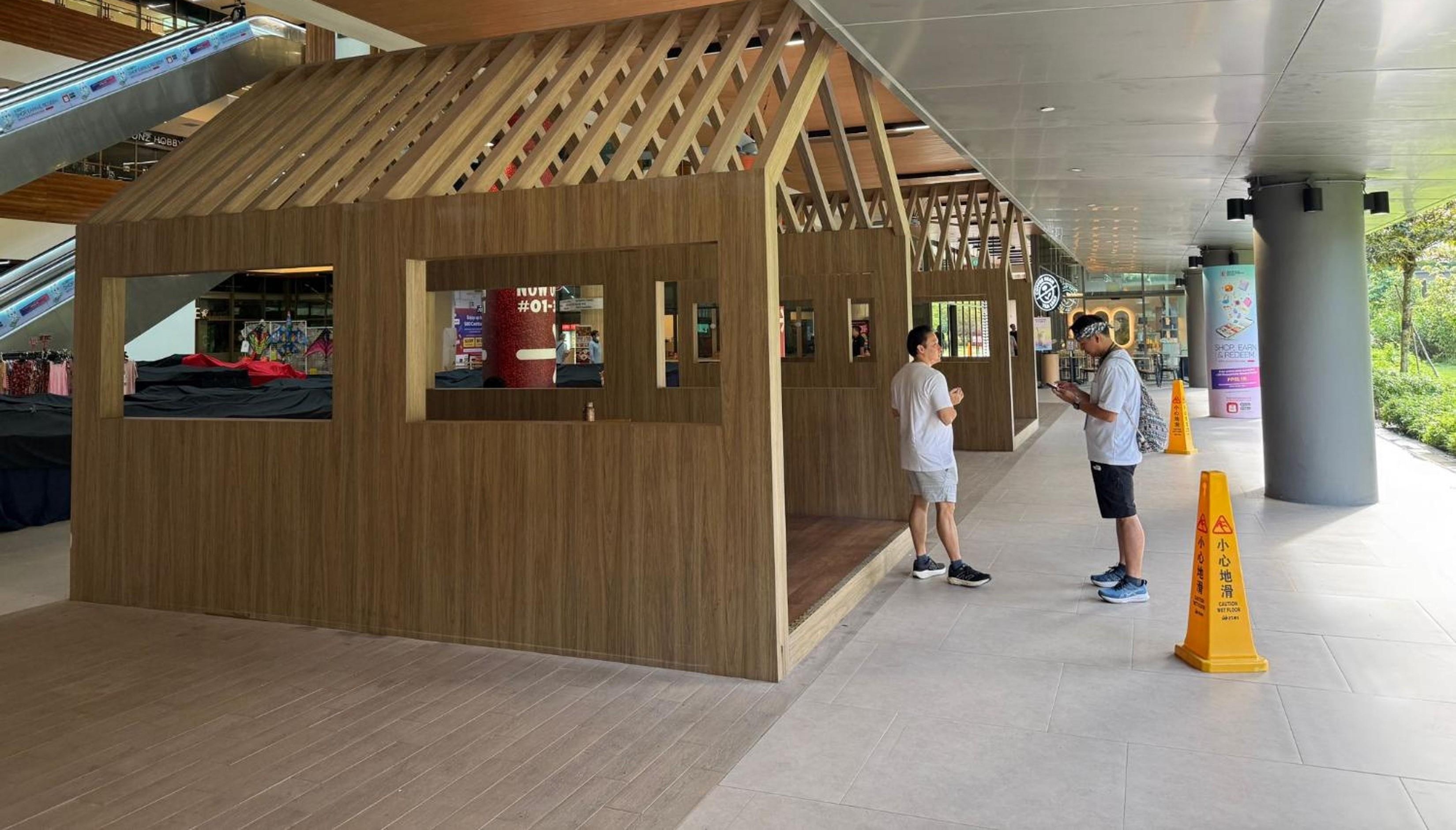 Wooden huts near Coffee Bean and Tea Leaf, the Quadtengah meetup at Plantation Plaza Tengah