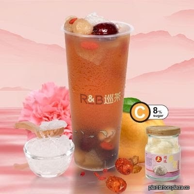 A large R&B Tea beverage with fruits, ice, and other ingredients.