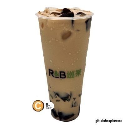 Iced milk tea with jelly in a clear cup, showing R&B Tea logo.